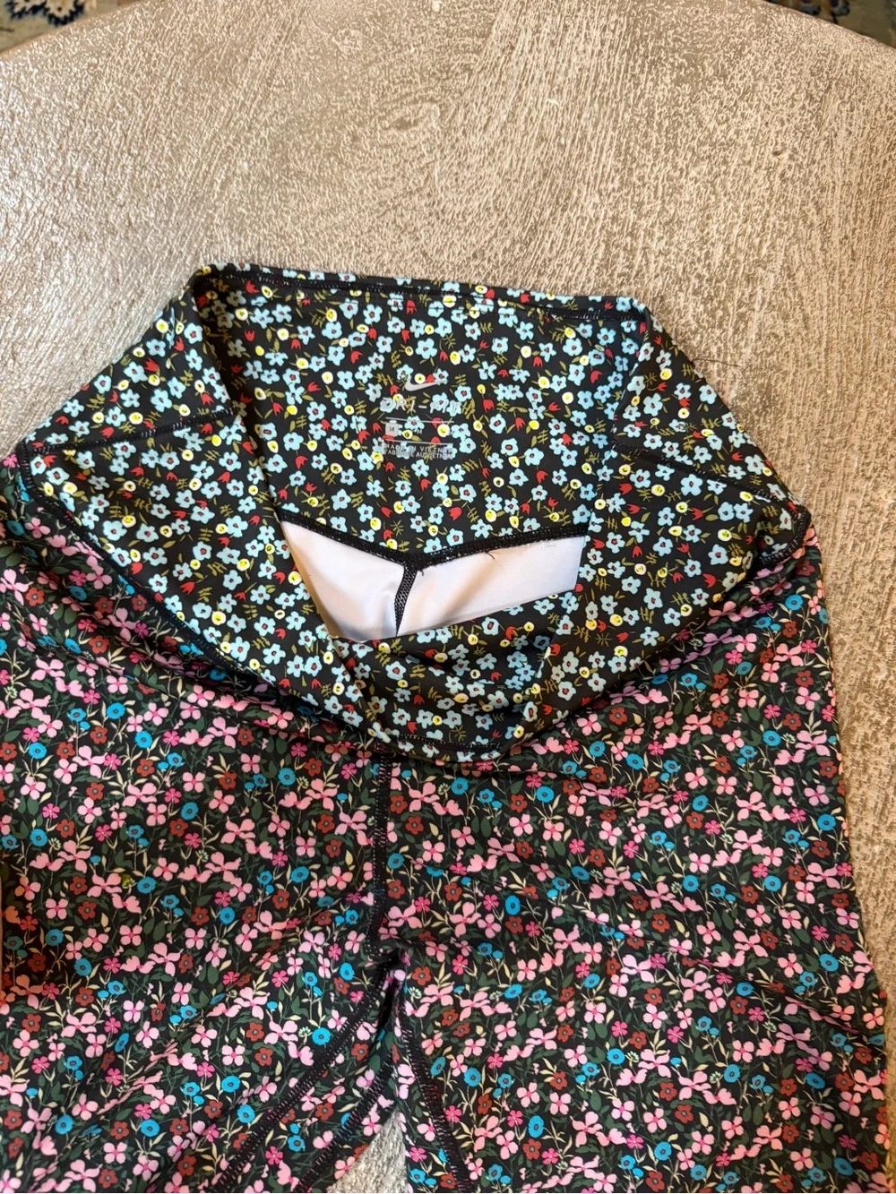 Nike Black Floral Leggings with Pink and Teal Accents